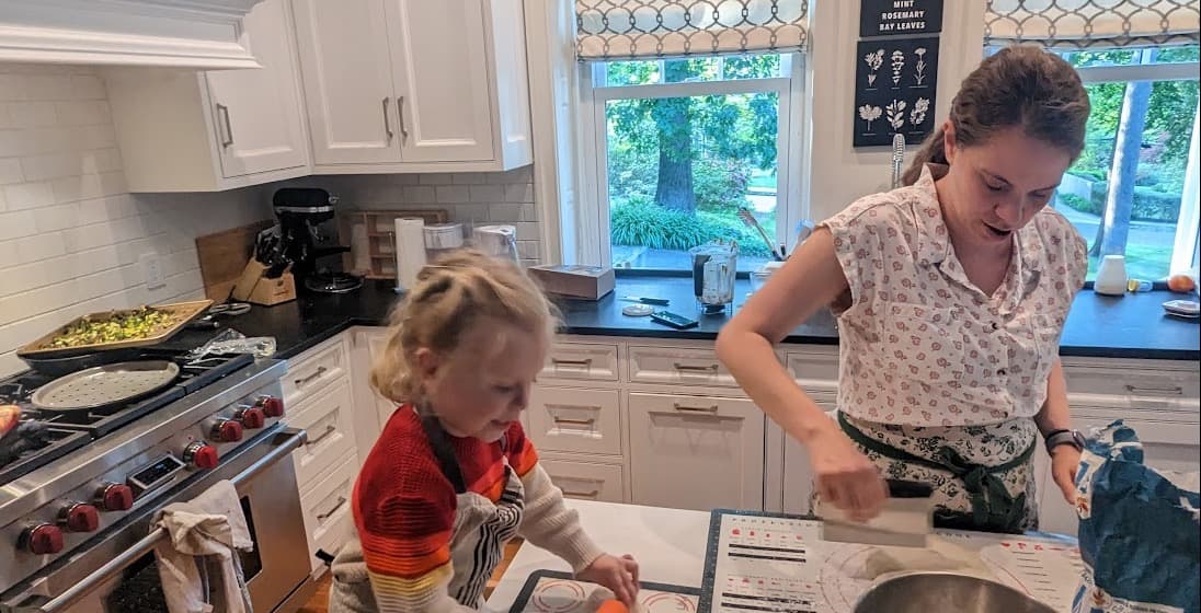 Mah baking with one of her kids in the kitchen